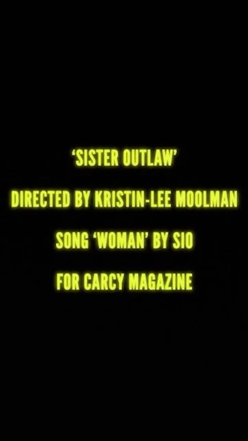 Text on a dark background displays the title 'Sister Outlaw' directed by Kristin-Lee Moolman, song 'Woman' by Sio for Carcy Magazine.