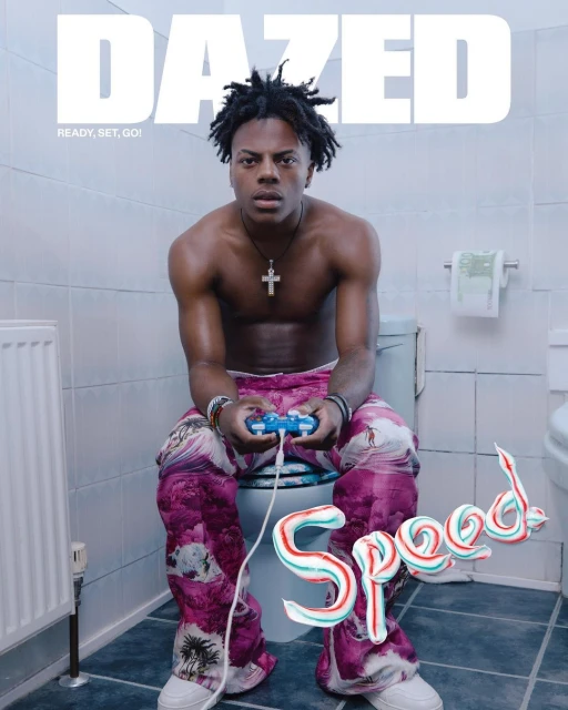 Shirtless man sits on toilet holding game controller on a Dazed magazine cover with text ‘Speed’ in toothpaste in a tiled bathroom.