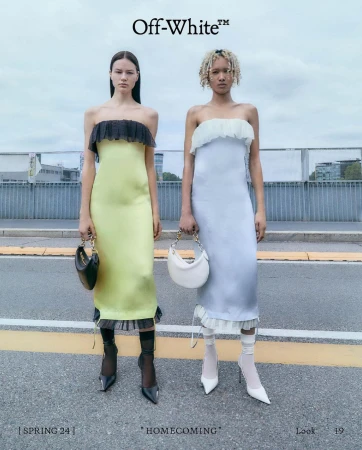 Two fashion models pose in strapless midi dresses with matching mini bags. One wears yellow with black accents, the other light blue with white.