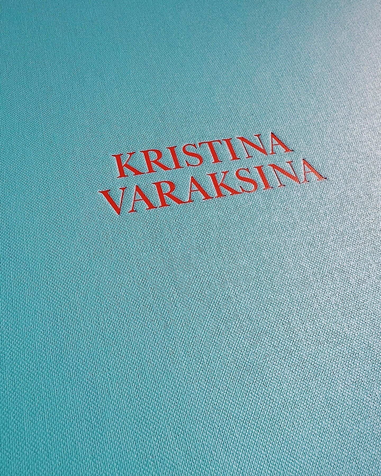 Red text 'KRISTINA VARAKSINA' on a textured teal background, possibly a book cover or design element with a modern aesthetic.