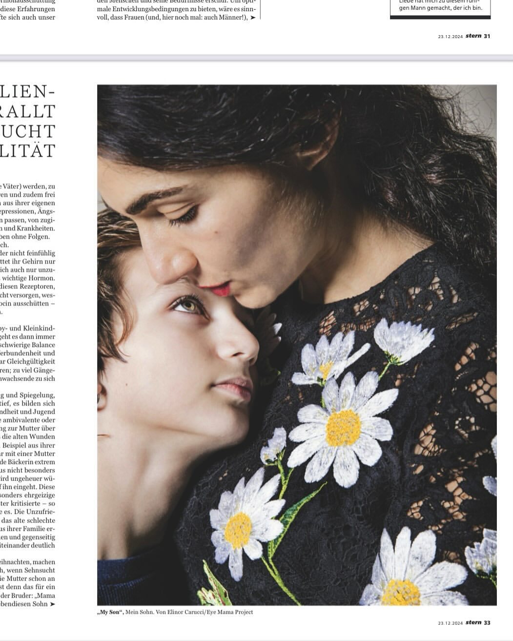 Close-up portrait of a young boy being kissed on the forehead by a woman, showcasing a tender moment in soft, natural light.