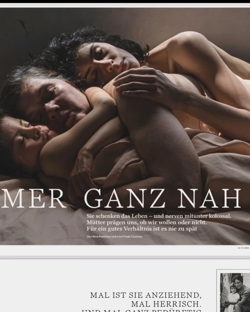 Candid portrait of a family of three females of mixed ages and skin tones, laying together on a bed with neutral color linens.