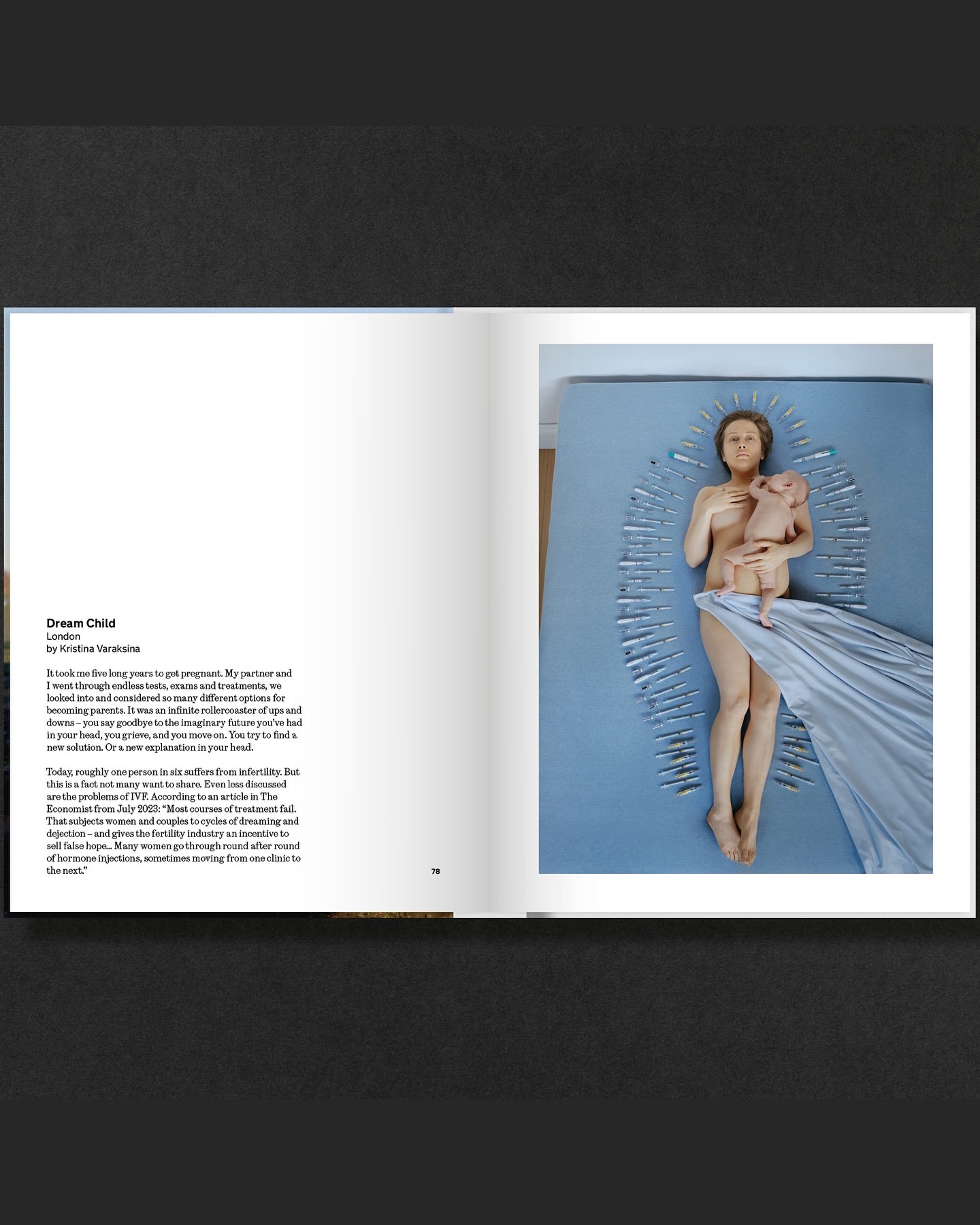 Art photography featuring a mother and baby laying on a blue surface surrounded by syringes, evoking themes of fertility and medical intervention.