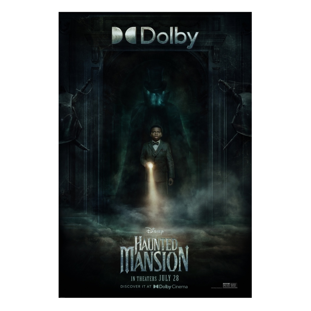 Movie poster for Disney's Haunted Mansion featuring a man in a suit holding a flashlight in a spooky, dark mansion setting.