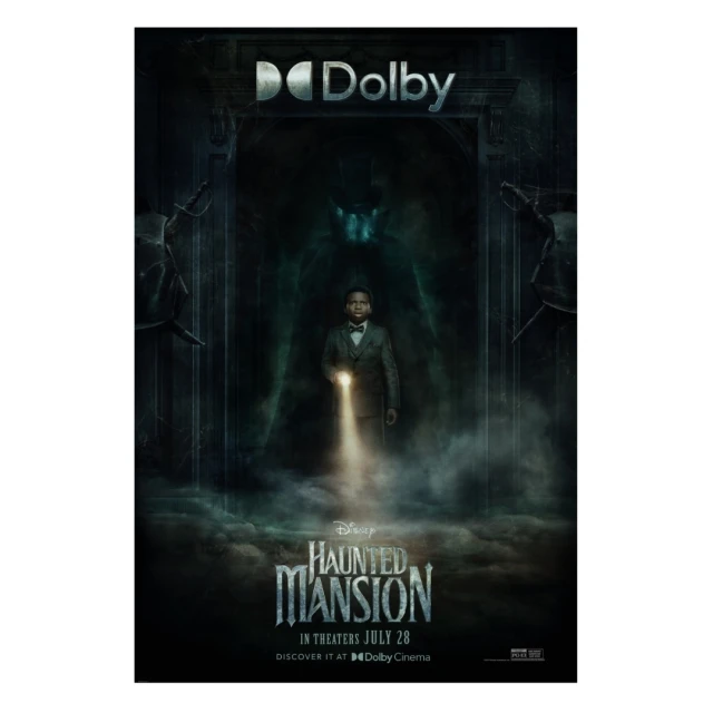 Movie poster for Disney's Haunted Mansion featuring a man in a suit holding a flashlight in a spooky, dark mansion setting.