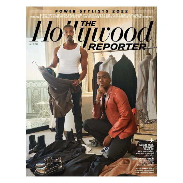 Magazine cover featuring Michael B. Jordan and a second adult male in an indoor setting with clothing racks.