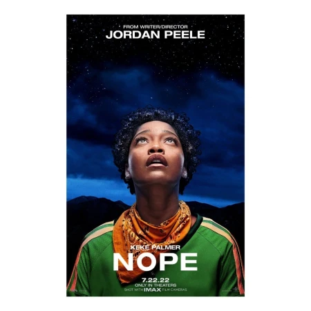 Movie poster for 'Nope' featuring Keke Palmer looking up toward the night sky and distant mountains. Science fiction and horror themes.