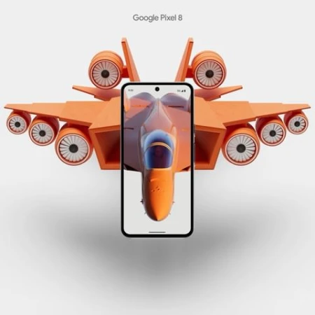 Orange toy fighter jet behind a black smartphone with a display showing an orange fighter jet cockpit against a white background.