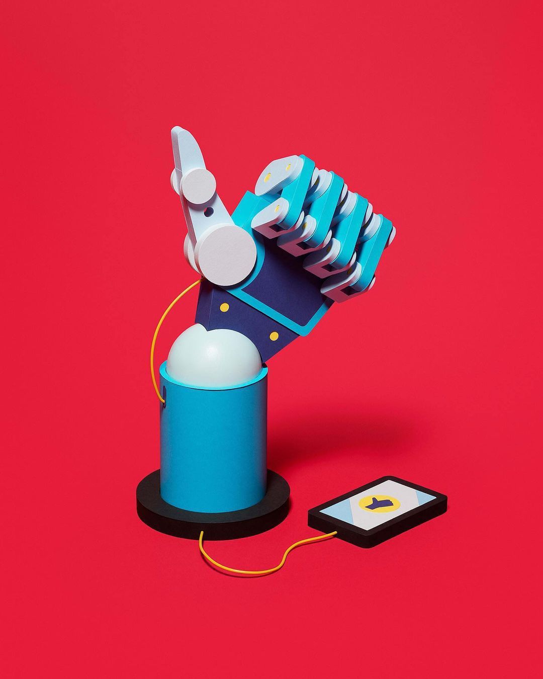 Illustration of an artificial robotic hand with a raised thumb, charging a cell phone against a red background.