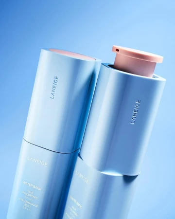 Two Laneige Water Bank Blue Hyaluronic Cream skincare products in light blue and pink tones against a light blue background.