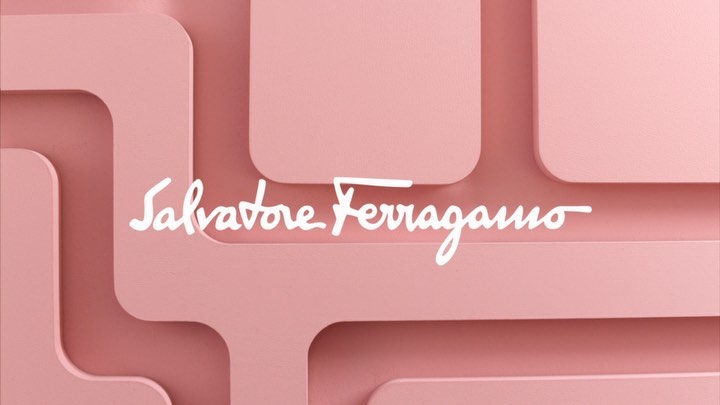 Salvatore Ferragamo logo on a layered pale pink background. Geometric design, minimalist aesthetic.
