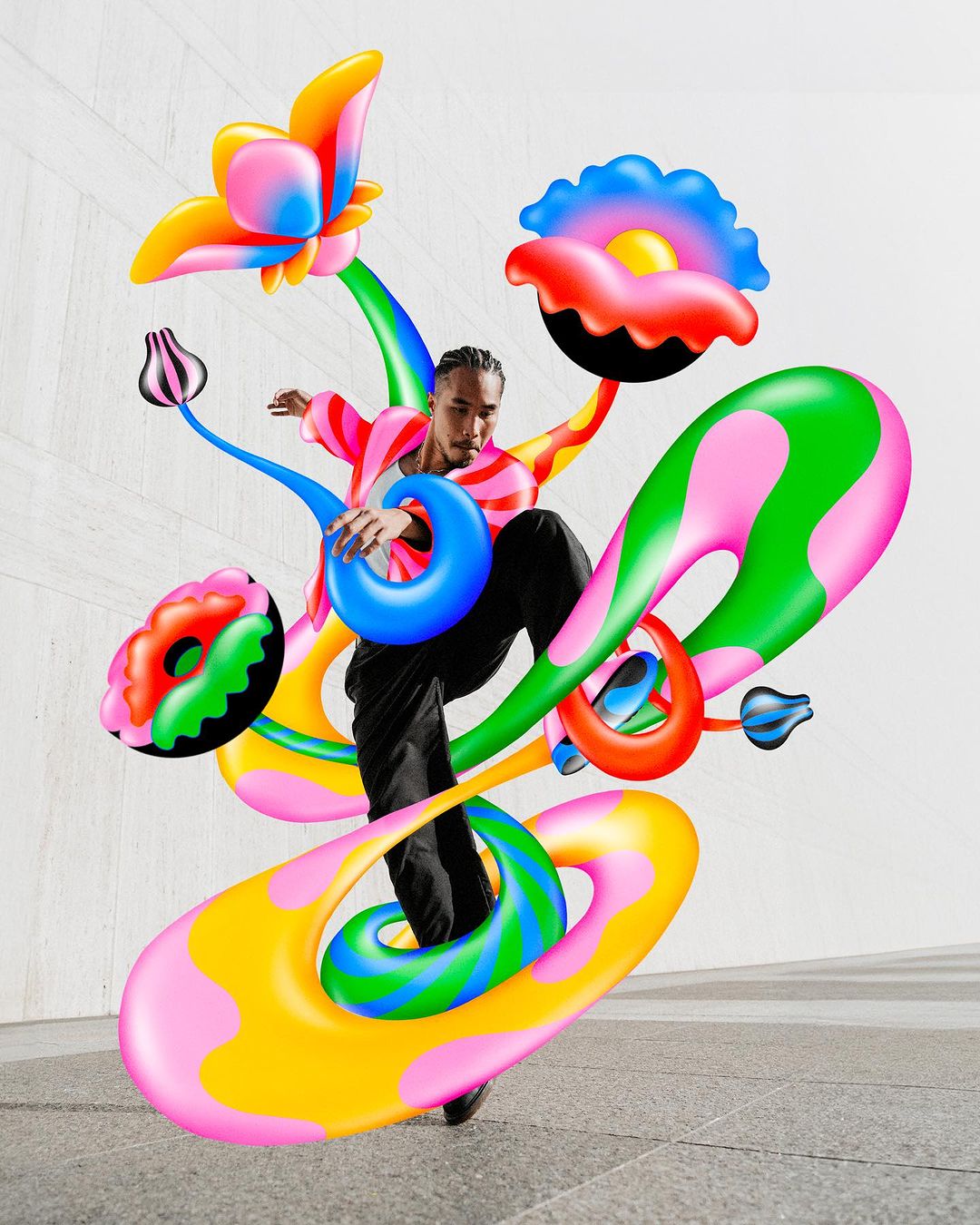 Man in motion, surrounded by vibrant, colorful, abstract, flower-like shapes, creating a dynamic and visually striking composition against a gray background.