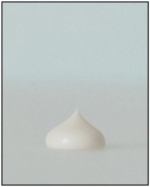 Close-up of a rounded peak of white cosmetic cream or lotion against a soft, diffused white background. Beauty product shot. 