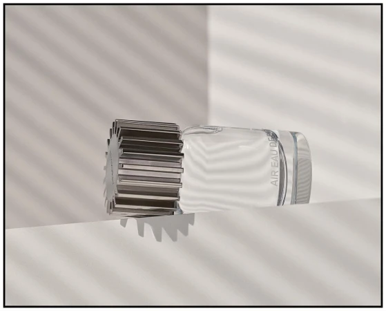 Crystal perfume bottle with a metallic cap, showcased on a clean white surface against a backdrop of soft, linear light patterns.
