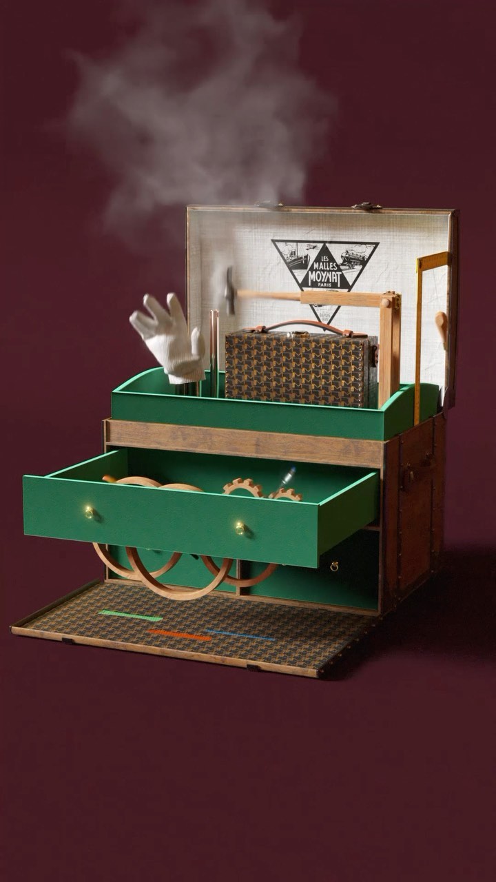 Whimsical steampunk-style trunk with mechanical details, gears, a travel bag, and a glove, set against a deep wine-colored background.