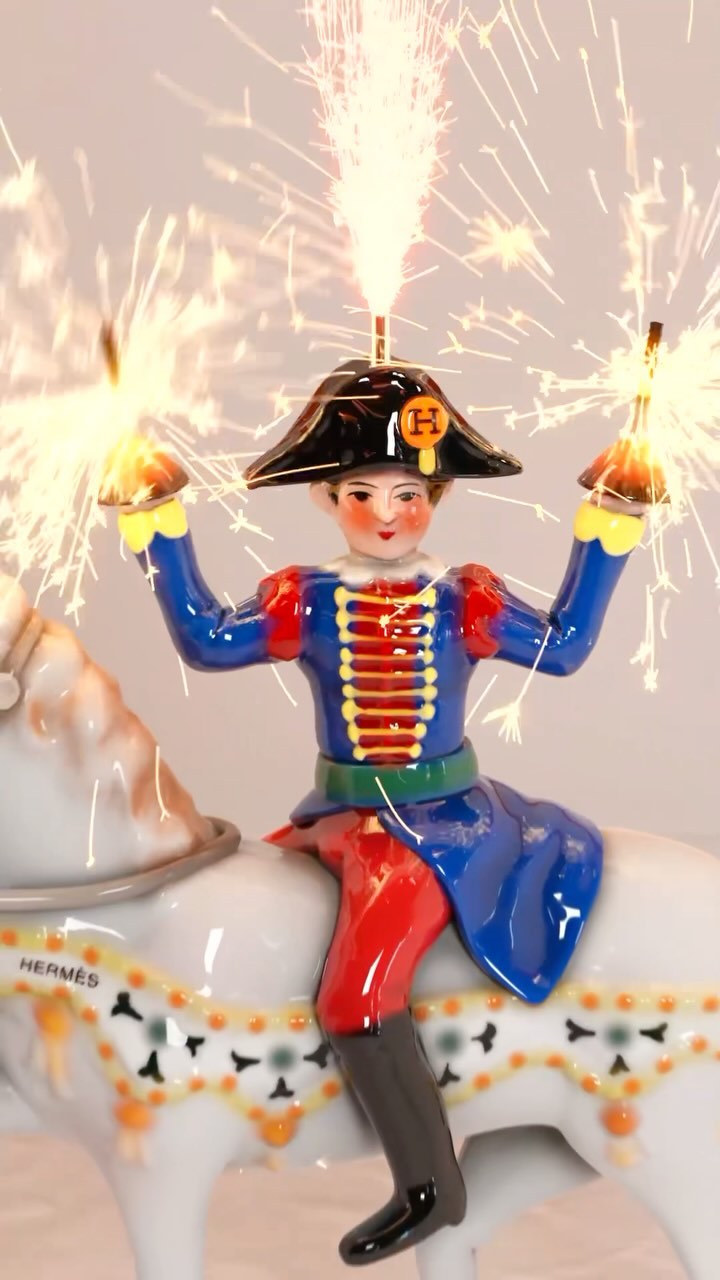 Toy figurine of a rider on a white horse with sparklers. Festive decor for special celebrations. Decorative ornament, collectible toy.