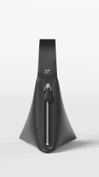 A black leather structured handbag with a prominent silver zipper and top handle against a solid white background.