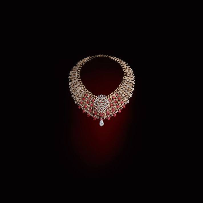 Elegant gold necklace with diamond and ruby accents on a dark backdrop, jewelry advertisement, luxury fashion accessory, close-up product shot.