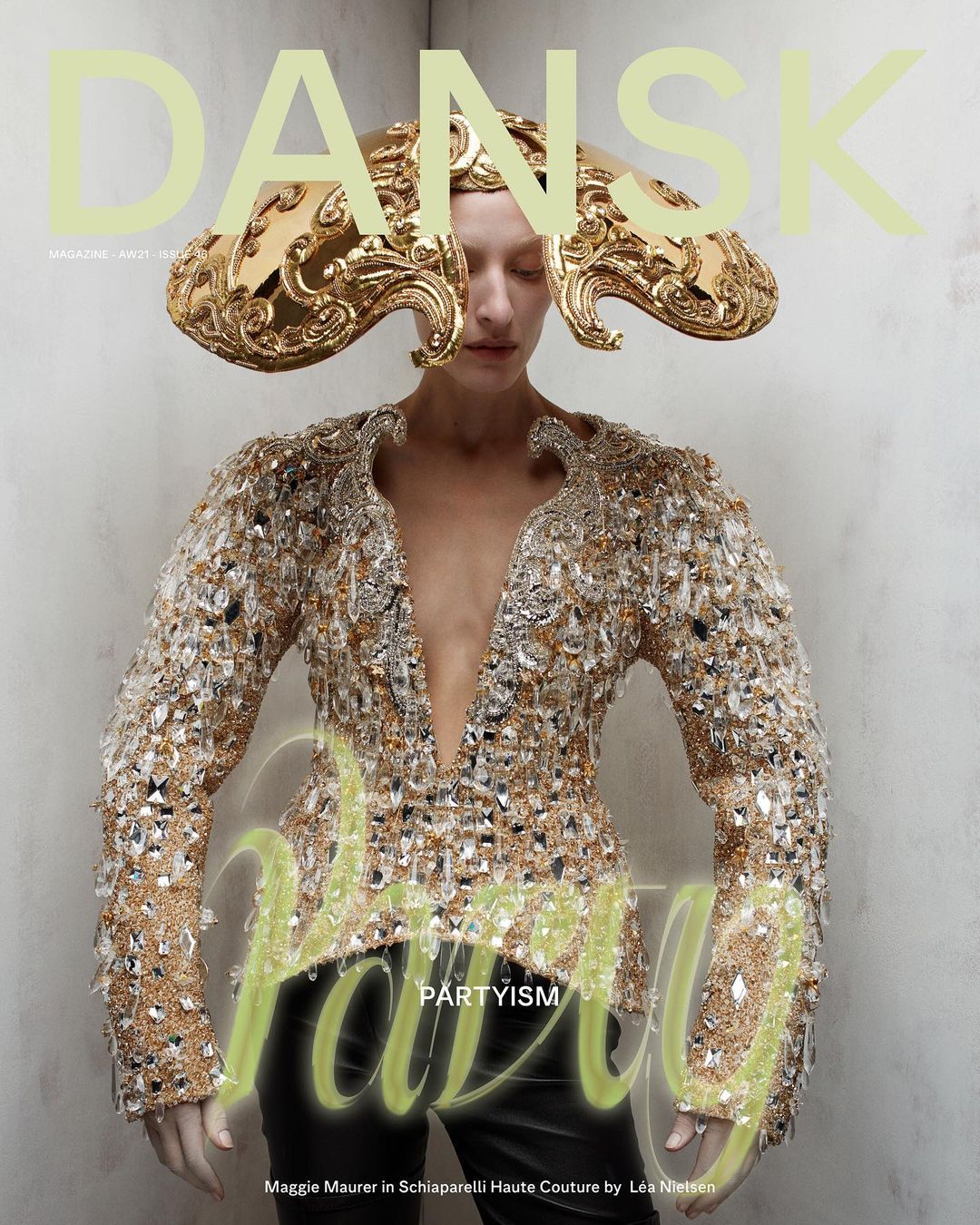 Magazine cover featuring a woman in an elaborate gold headpiece and heavily embellished jacket, with the title 'Dansk' in large letters.