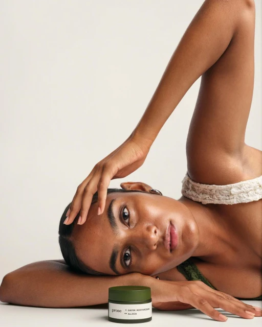 Adult woman with olive skincare product in studio. Close-up product shot with beauty shot of model in beauty product advertisement.
