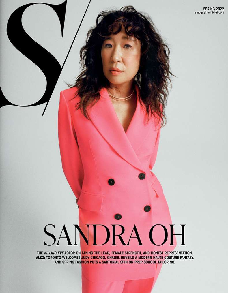 Magazine cover featuring Sandra Oh in a pink suit against a white background with bold typography and Spring 2022 text.