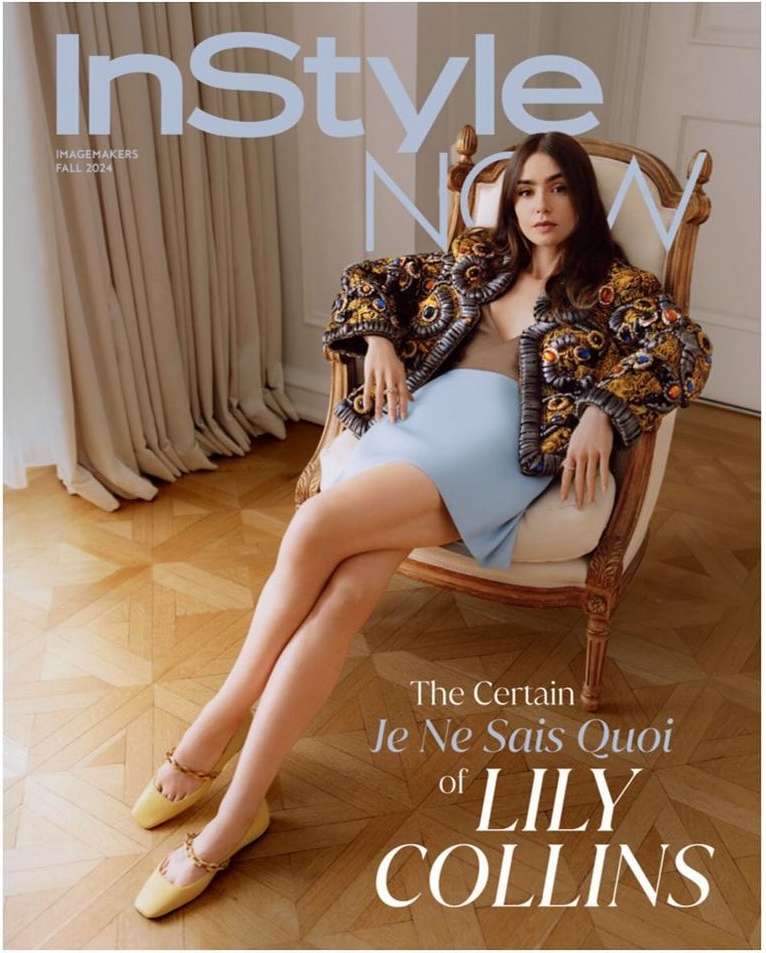 Magazine cover featuring Lily Collins seated in an ornate chair, wearing a patterned jacket and light blue skirt against a neutral backdrop.