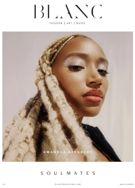 Close-up portrait of Amandla Stenberg on a Blanc magazine cover. Stenberg has blonde braids and wears silver eye shadow and pink lip gloss.