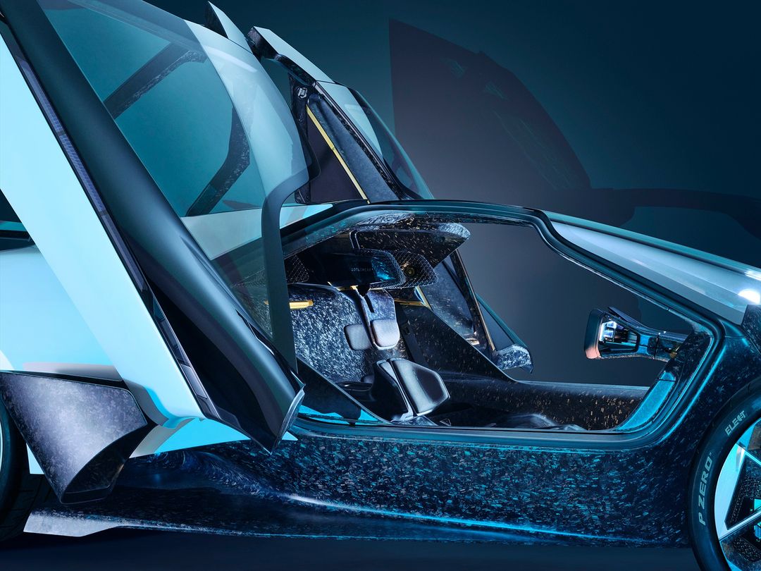 Sleek futuristic car interior showcases advanced design with open butterfly doors, emphasizing a blend of luxury and technological innovation.