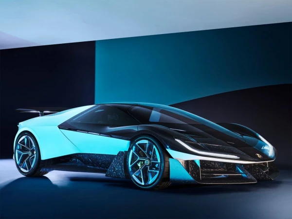 Sleek black and turquoise concept car with futuristic design in a studio, showcasing sharp angles, glowing accents, and aerodynamic features.