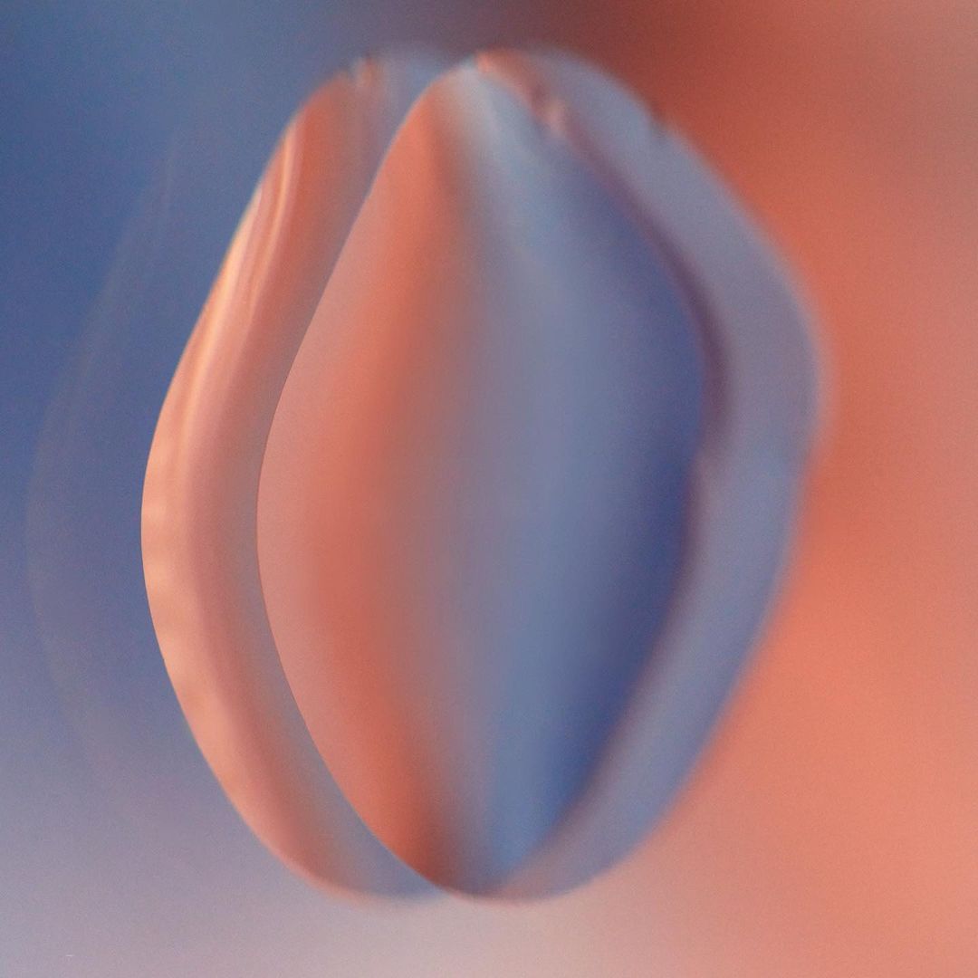 Abstract art with smooth shapes in a gradient of blue and peach tones, soft focus, and minimalistic composition.
