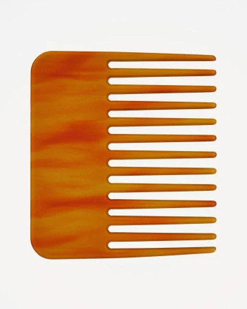 Close-up studio shot of a brown, patterned hair comb on a white background, used for detangling and styling hair.