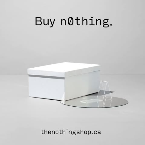 White box with lid displayed on a reflective disc, with the phrase 'Buy nothing' above and website address below, on a light background.