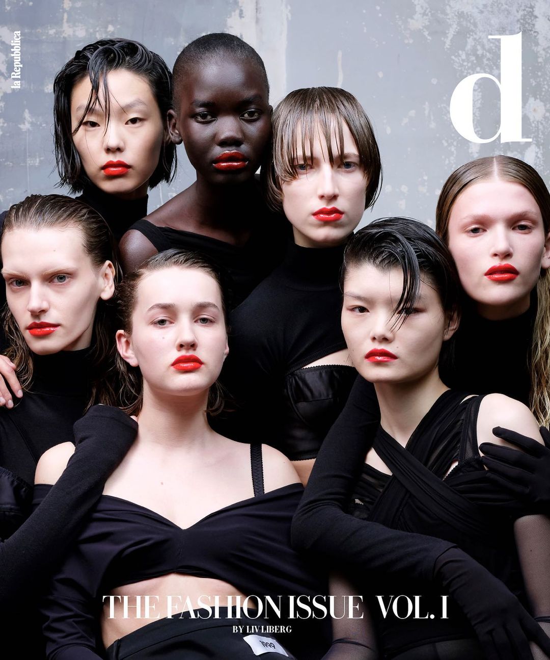 Fashion magazine cover featuring seven women models with red lipstick and dark clothing, indoor setting and studio lighting.