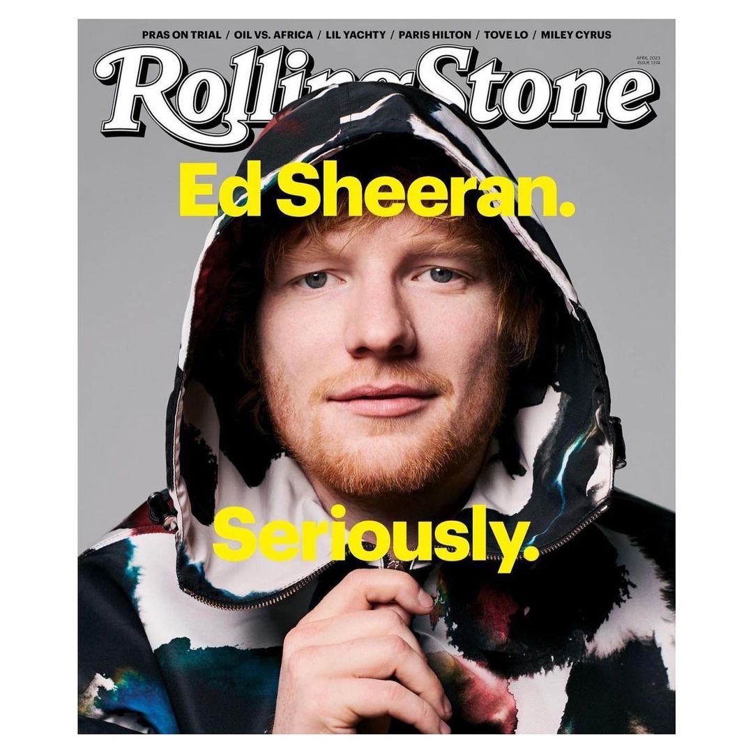 Ed Sheeran on the cover of Rolling Stone magazine, wearing a hooded jacket, with bright yellow text overlay on a grey background.