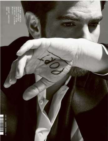 Close-up portrait of Andrew Garfield by photographer Liz Collins, holding his hand with written text over his face.