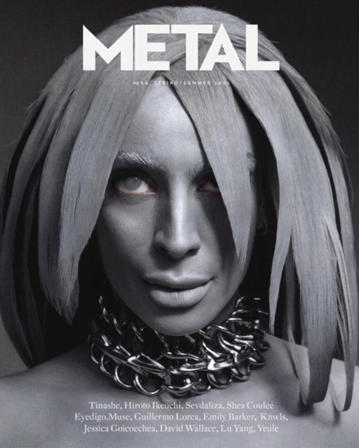 Metal Magazine cover featuring an adult female with silver body paint, chain necklace, and unique hairstyle against a dark gray background.