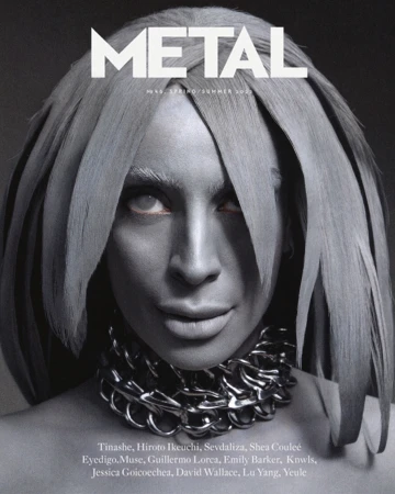 Metal Magazine cover featuring an adult female with silver body paint, chain necklace, and unique hairstyle against a dark gray background.