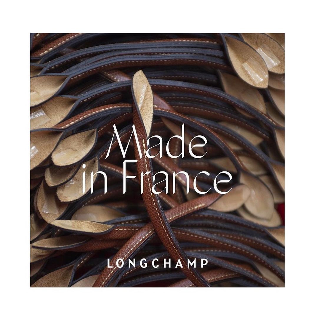 Overlapping Longchamp handbag straps in hues of tan and brown, stitched with dark thread, and featuring the 'Made in France' logo.