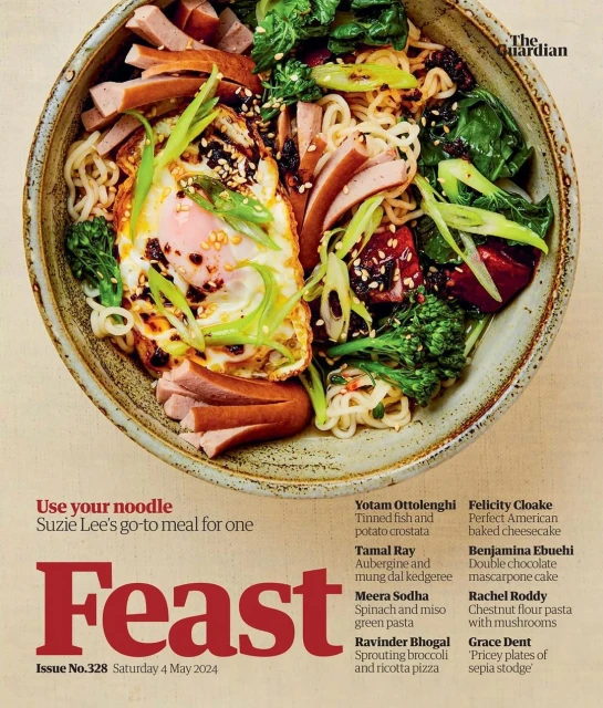 Overhead shot of noodle bowl with fried egg, greens, and sliced meat, magazine cover, featuring Feast and The Guardian logo.
