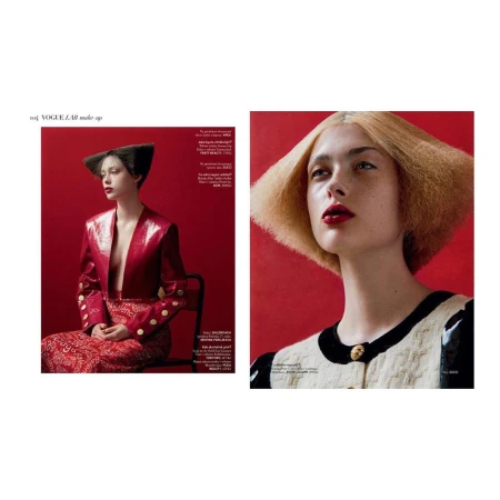 Two-page magazine spread featuring fashion photography by Lucian Bor with models in bold red and textured garments against red backgrounds.