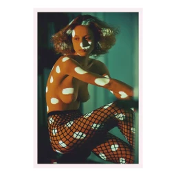 Woman wearing fishnet tights with projected white light patterns across her skin and hair, photographed in Paris.