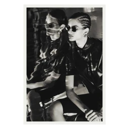 Monochrome fashion editorial portrait of two women wearing sunglasses and dark leather shirts in Paris by Lucian Bor