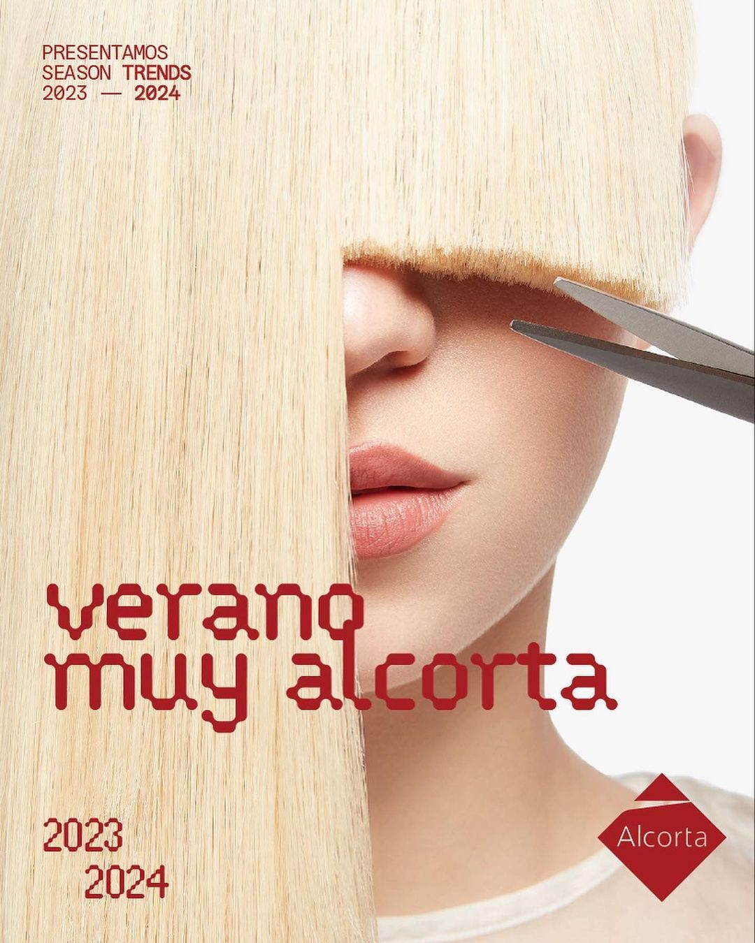 Woman's face is partially obscured by her straight, blond hair and blunt bangs, and someone is cutting her hair with scissors.