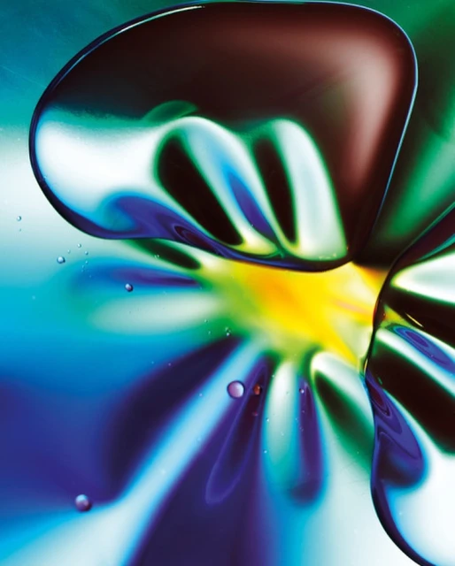 Abstract image featuring blurred shapes with a vibrant color palette of blues, greens, yellows, and browns, creating a mesmerizing visual effect.