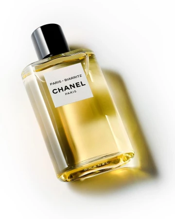 CHANEL Paris-Biarritz perfume bottle resting on a white seamless background with soft directional shadow