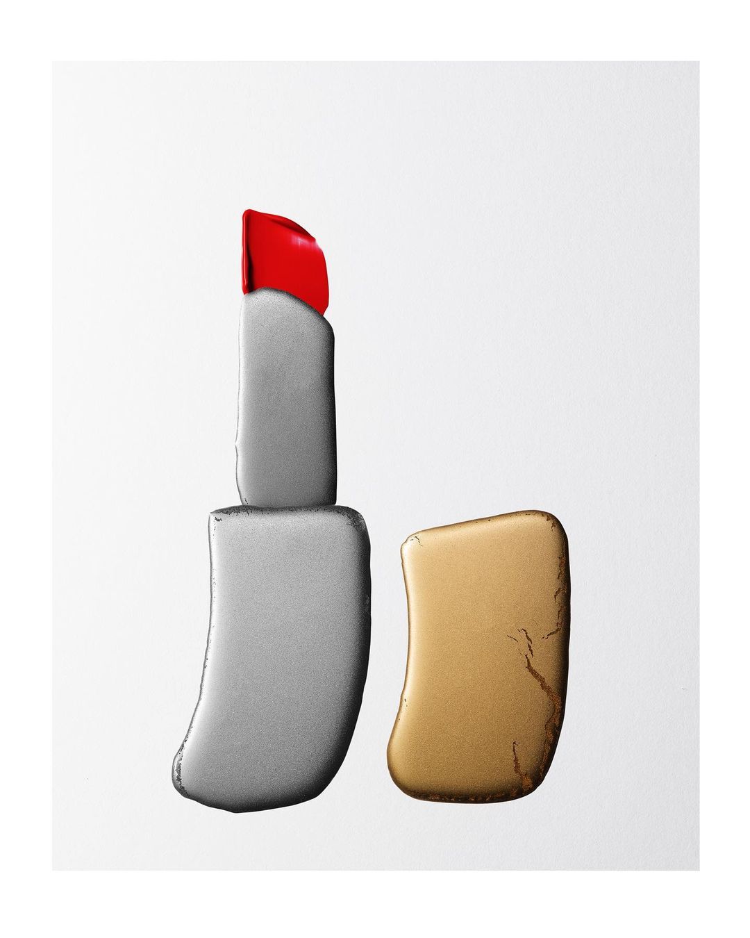 Still life shot of opened lipstick tube with silver body and red cap on a white background in a square, studio-lit composition.