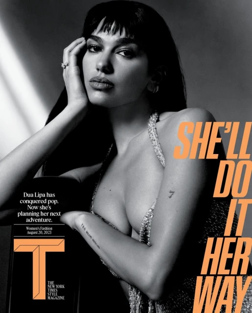 Black and white fashion magazine cover featuring Dua Lipa in a glittering halter top, with orange and black text overlay.