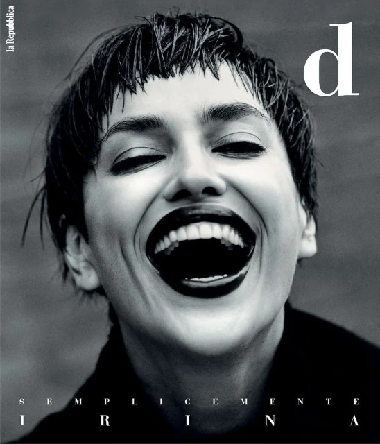 Black and white fashion magazine cover featuring a woman with short dark hair, dark lipstick, laughing with her eyes closed, and the brand logo.