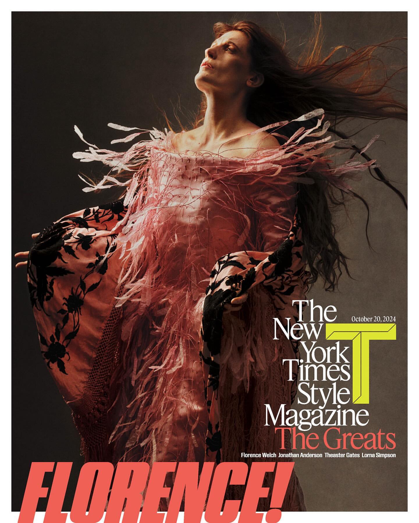 Magazine cover featuring a woman in a pink feathered dress looking up against a dark background, with magazine text overlay.