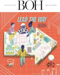 Magazine cover illustration by Luisa Jung showing four people collaborating over architectural blueprints on a large desk.